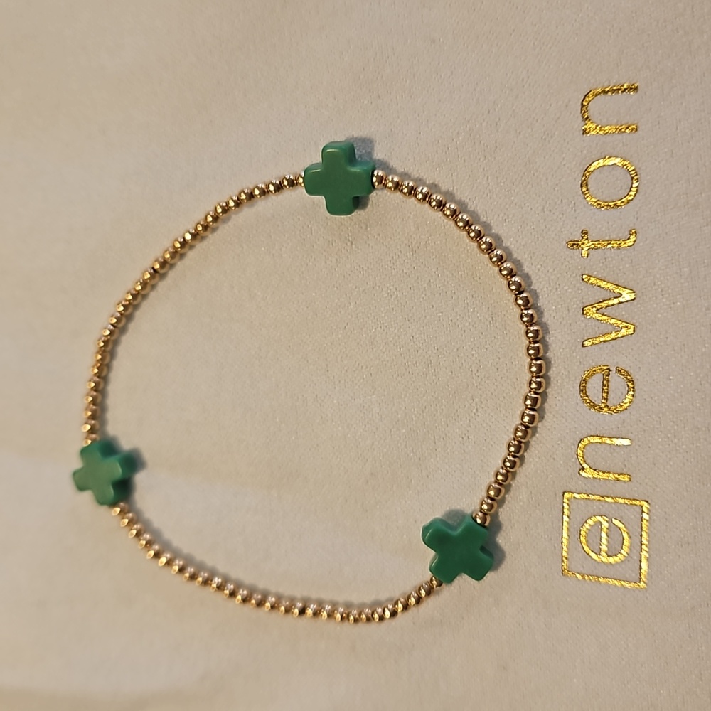 Enewton signature cross pattern emerald